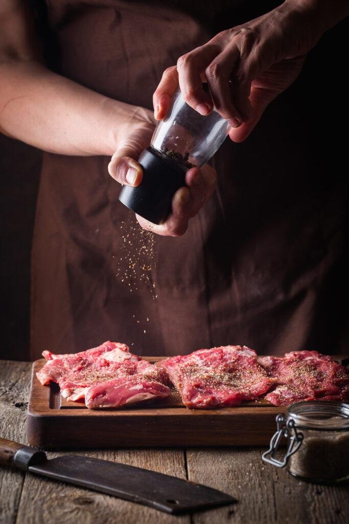 a man is cooking a canadian goose steaks